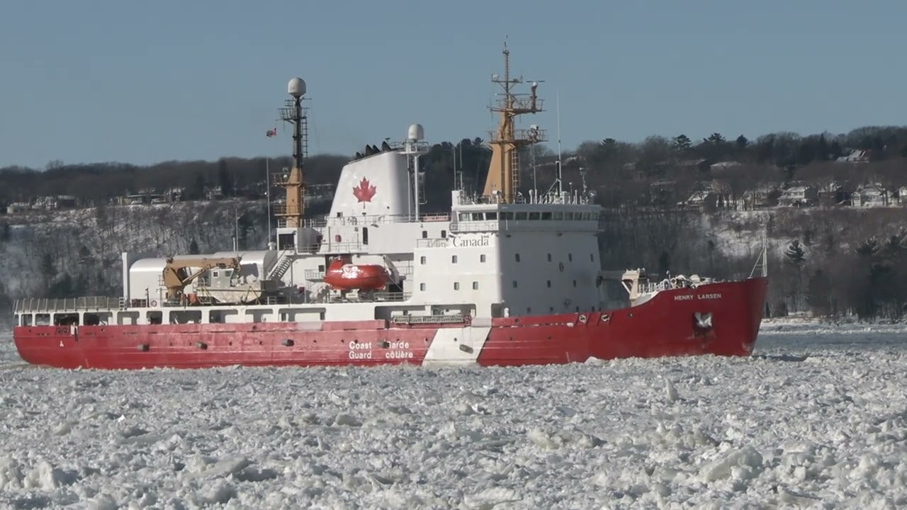 Icebreaker CCGS Henry Larsen clearing ice on the St.Lawrence River beneath Quebec Bridges