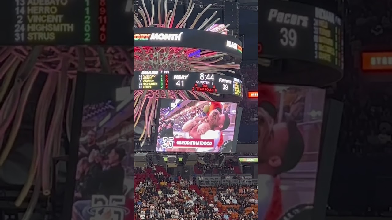 Surprised on Kiss Cam with My Goldendoodle at Miami HEAT Game! 🐶❤️
