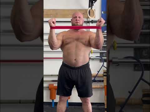 Effective Shoulder Pain Relief Exercise Demonstrated by Pro Strongman Travis Ortmayer