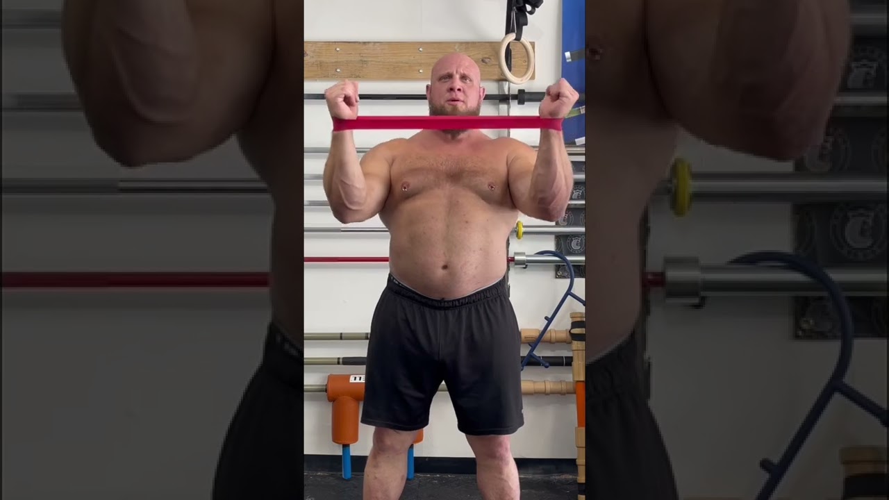 Effective Shoulder Pain Relief Exercise Demonstrated by Pro Strongman Travis Ortmayer