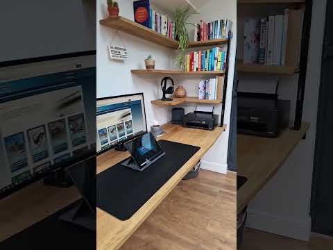 Custom oak table and floating shelves for this home office workspace.