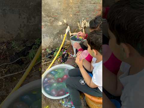 Let’s play Holi  🔫💦 #holi #waterballoons #trending #shorts