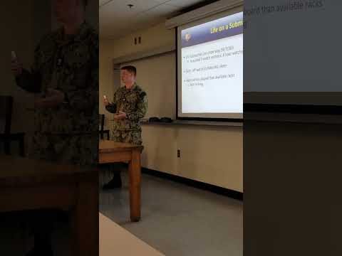 A midshipman discussing a combinatorial optimization problem for watchbills and berthing plans.