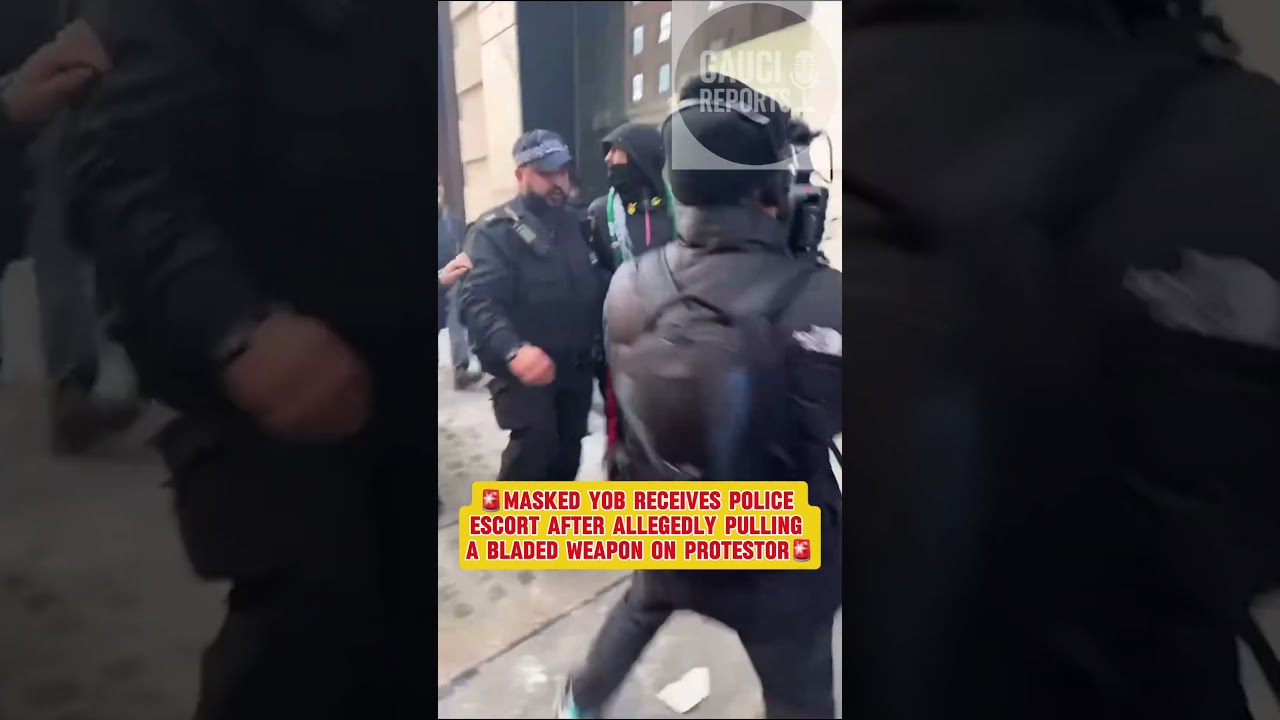 Masked Man with Blade Escorted Away at UKIP March