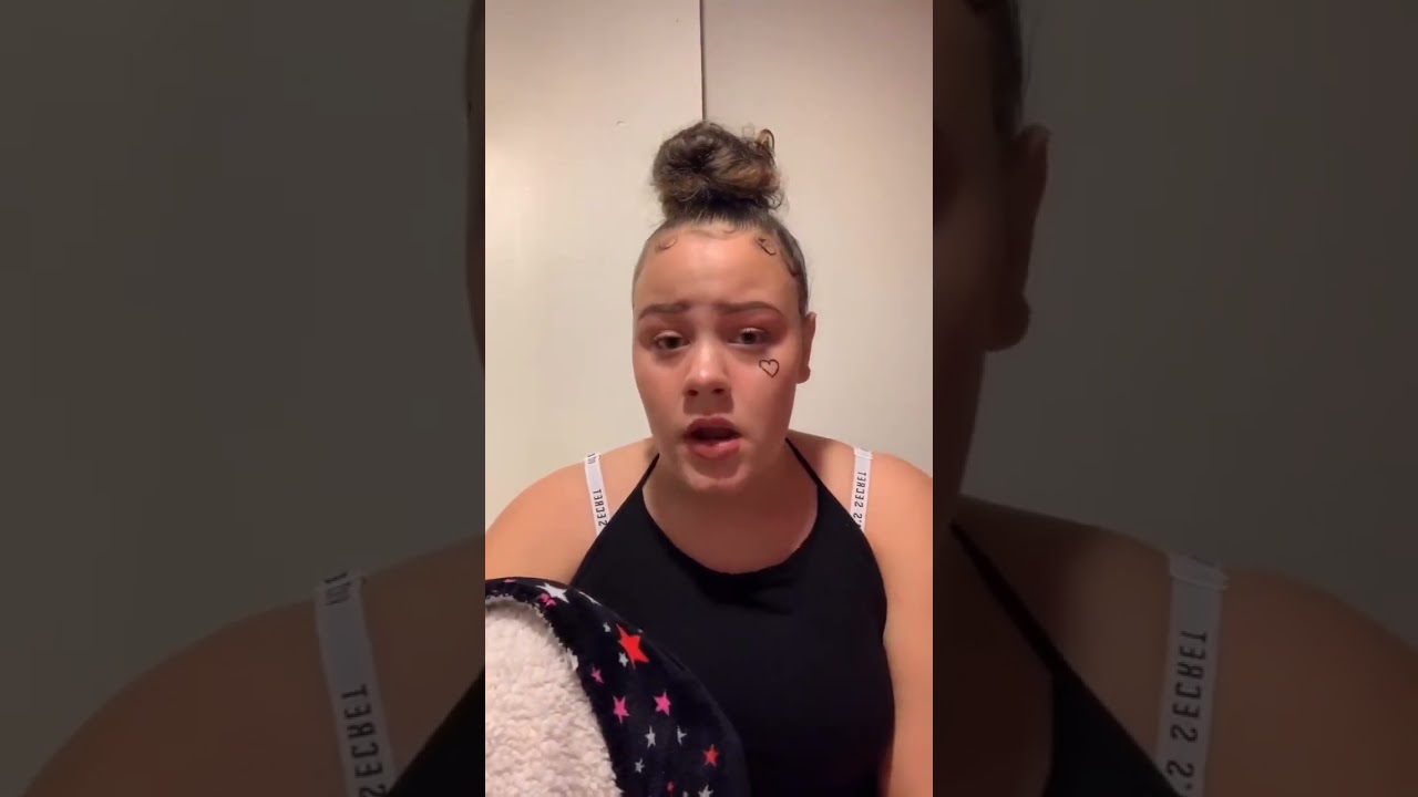 Passionate Young Woman Singing with Heartfelt Emotion 🎤