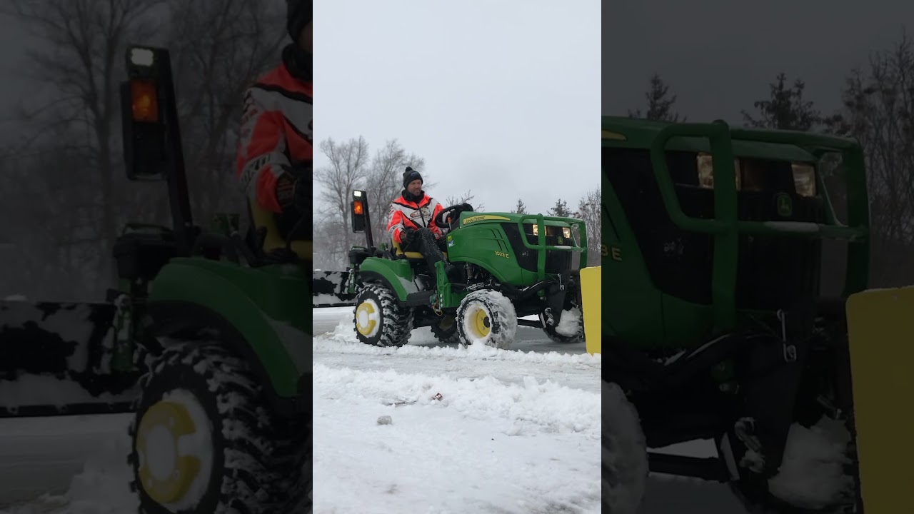 John Deere 1023E blowing snow.