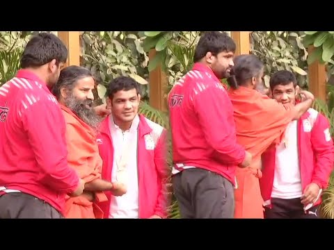 Wrestlers Sushil Kumar and Sumit Malik Visit Yoga Guru Baba Ramdev