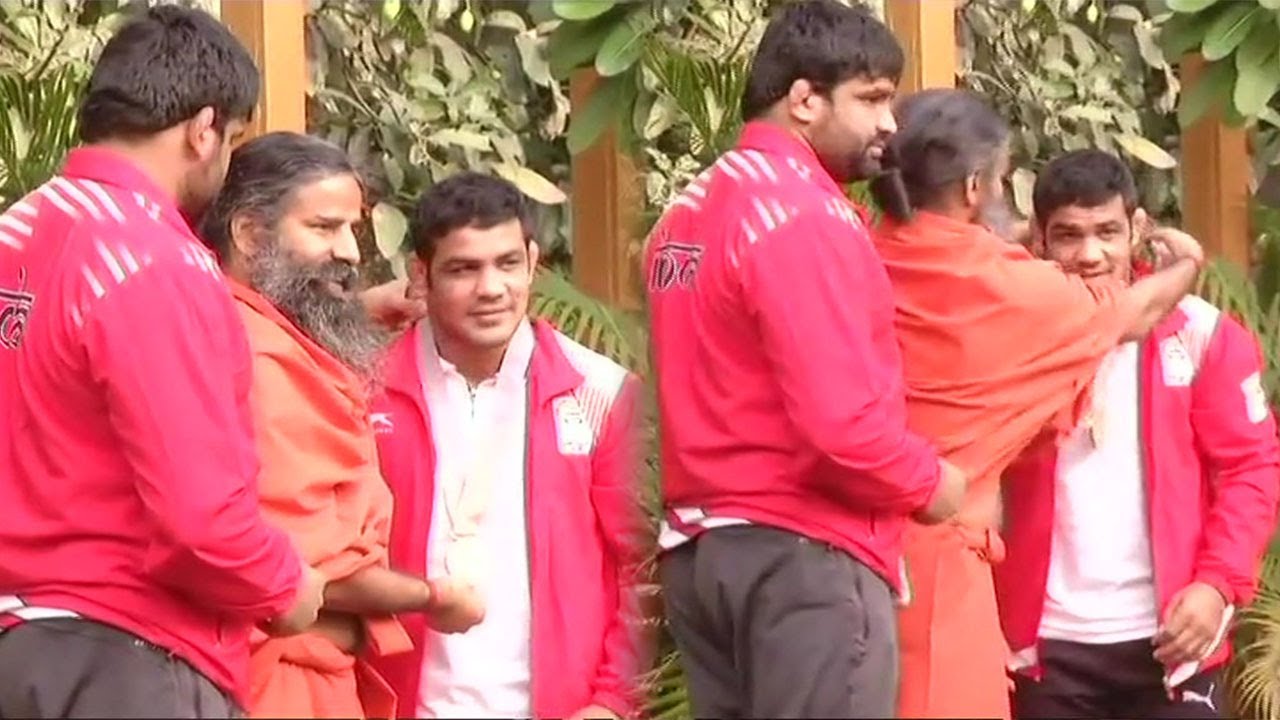 Wrestlers Sushil Kumar and Sumit Malik Visit Yoga Guru Baba Ramdev