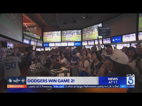 Fans in downtown L.A. celebrate Dodgers winning Game 2 of 2025 World Series