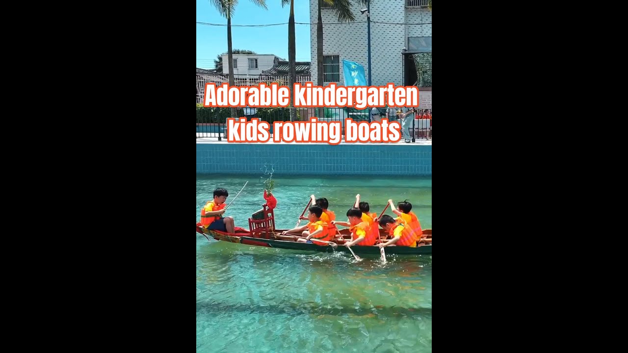 Adorable kindergarten kids rowing boats for Dragon Boat Festival