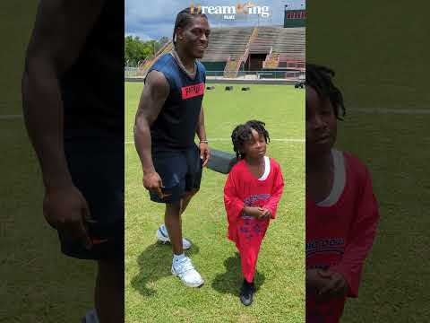 New England Patriots RB Terrell Jennings signing autographs at Demario Douglas Football Camp 2025