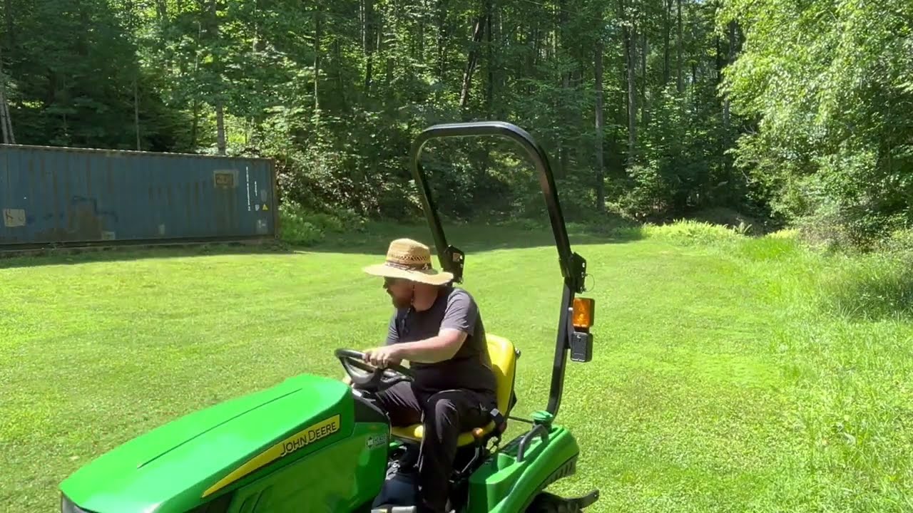 The John Deere 1023E makes easy mowing of tough terrain!