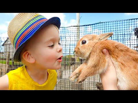 Vlad e Niki alimentando animais na fazenda