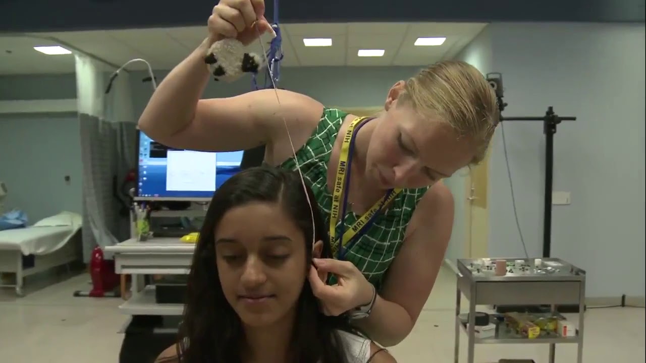 At the NIH Clinical Center: Ana de Campos works with patients with cerebra palsey