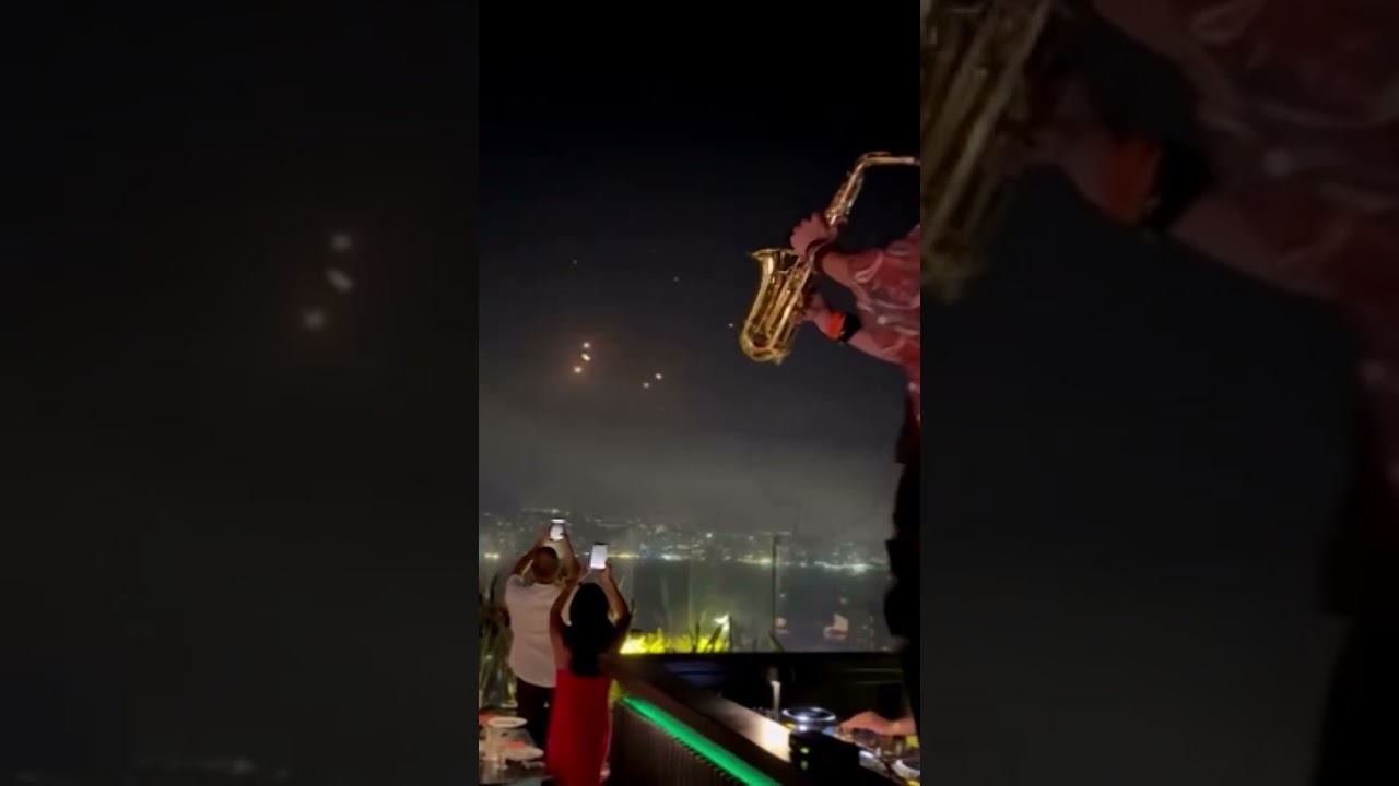 Lebanese Saxophonist Performs Amid Iran's Missile Attack on Israel 🎶🚀