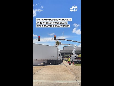 Dashcam video shows moment an 18-wheeler truck slams into a traffic signal worker