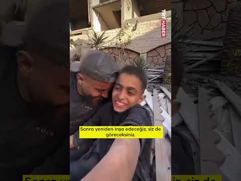 Katil İsrail'in enkaza çevirdiği Gazze'de Filistinli baba oğulun umut dolu kahkahaları yankılandı