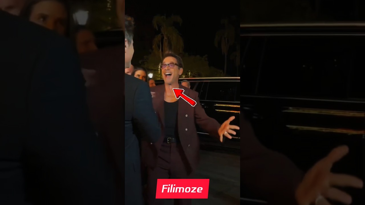 Downey Jr. & Murphy Reunite in Stylish Backstage Moment