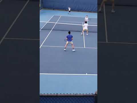 Tweener defense during tennis doubles match