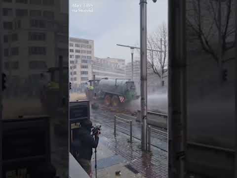 Manure-Spraying Tractor Faces Off With Police During Farmers' Protest