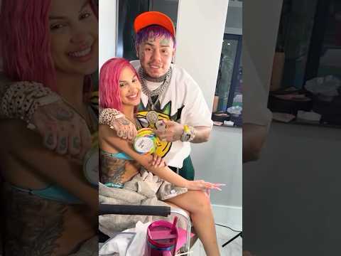 6ix9ine with his girlfriend while she gets ready for the FAX music video shoot