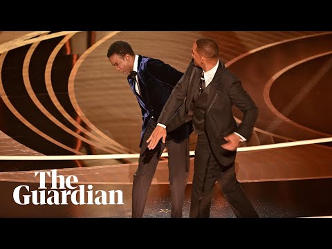 Watch the uncensored moment Will Smith smacks Chris Rock on stage at the Oscars, drops F-bomb