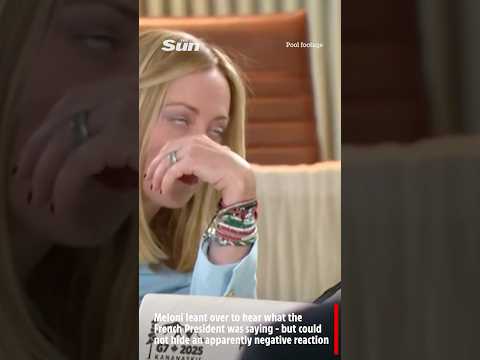 Italian PM Giorgia Meloni rolls her eyes as President Macron whispers to her at G7 roundtable