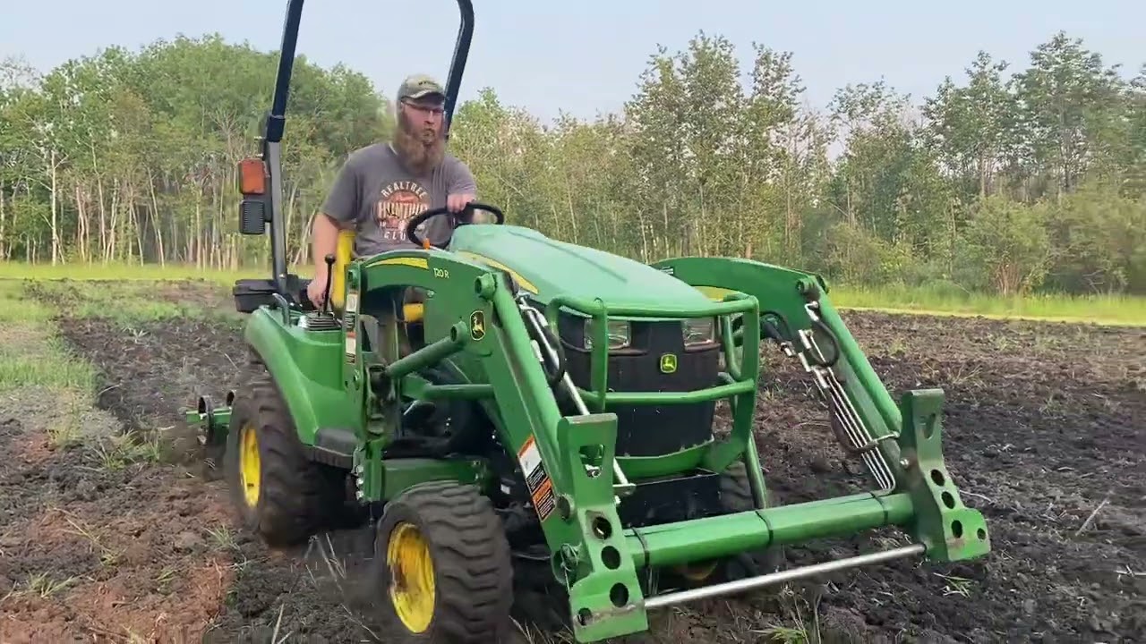 John Deere 1023E Cultivating and Tilling Garden