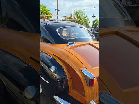 1948 Chrysler Town & Country sedan cruising by slow