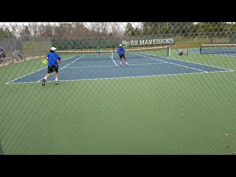 High school tennis doubles match