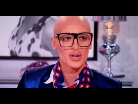 Milk looking confused while dressed as RuPaul