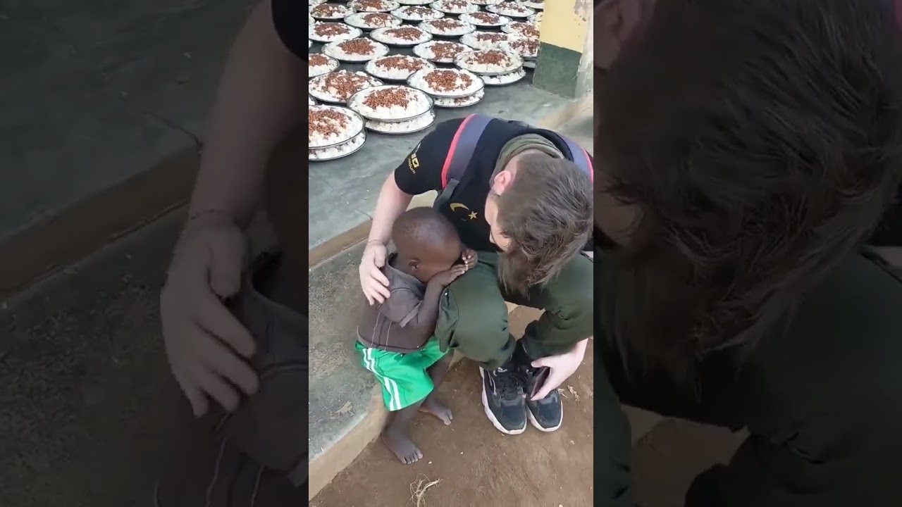 Heartbreaking Video: African Child Crying for Food on a Helper's Lap 😢