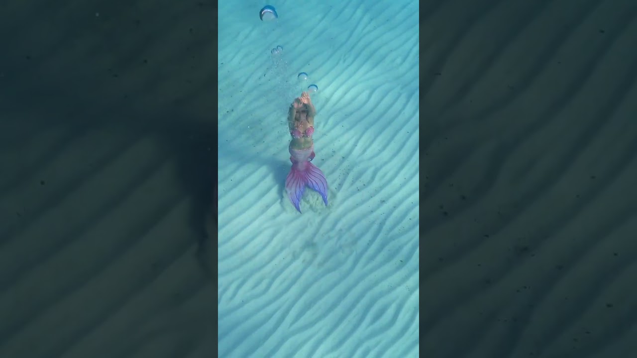 Pink mermaid swims to the ocean’s surface! #mermaid #beach #ocean #bahamas #travel #underthesea #h2o