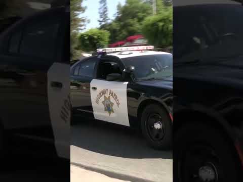 “Turn Right” CHP using PA system on traffic stop.