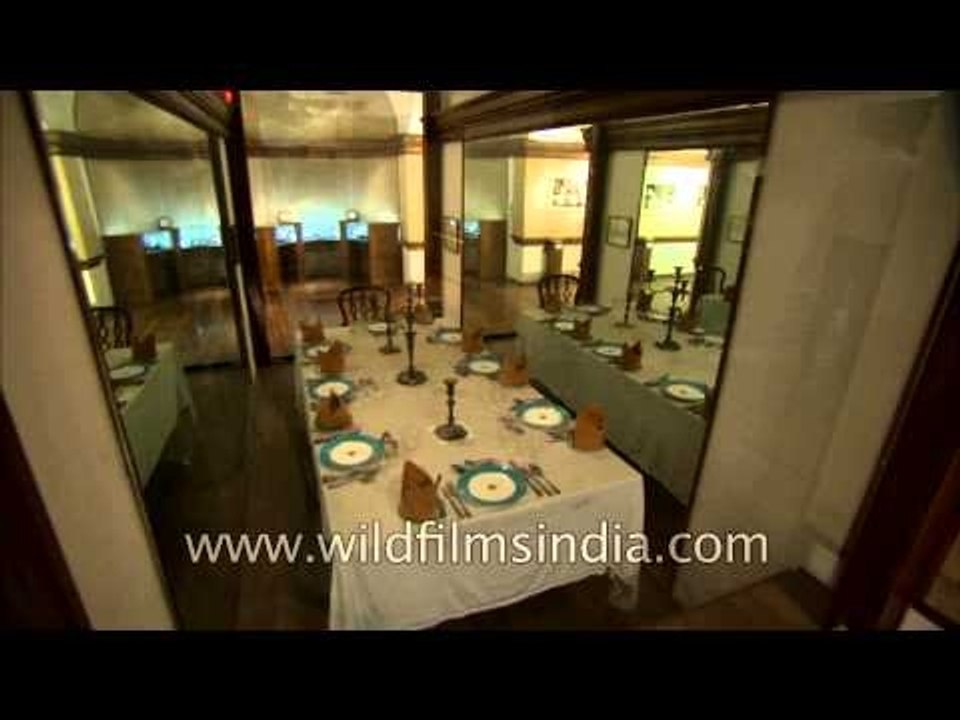 Crockery displayed with the dining table and chairs designed by Sir Edwin Lutyens