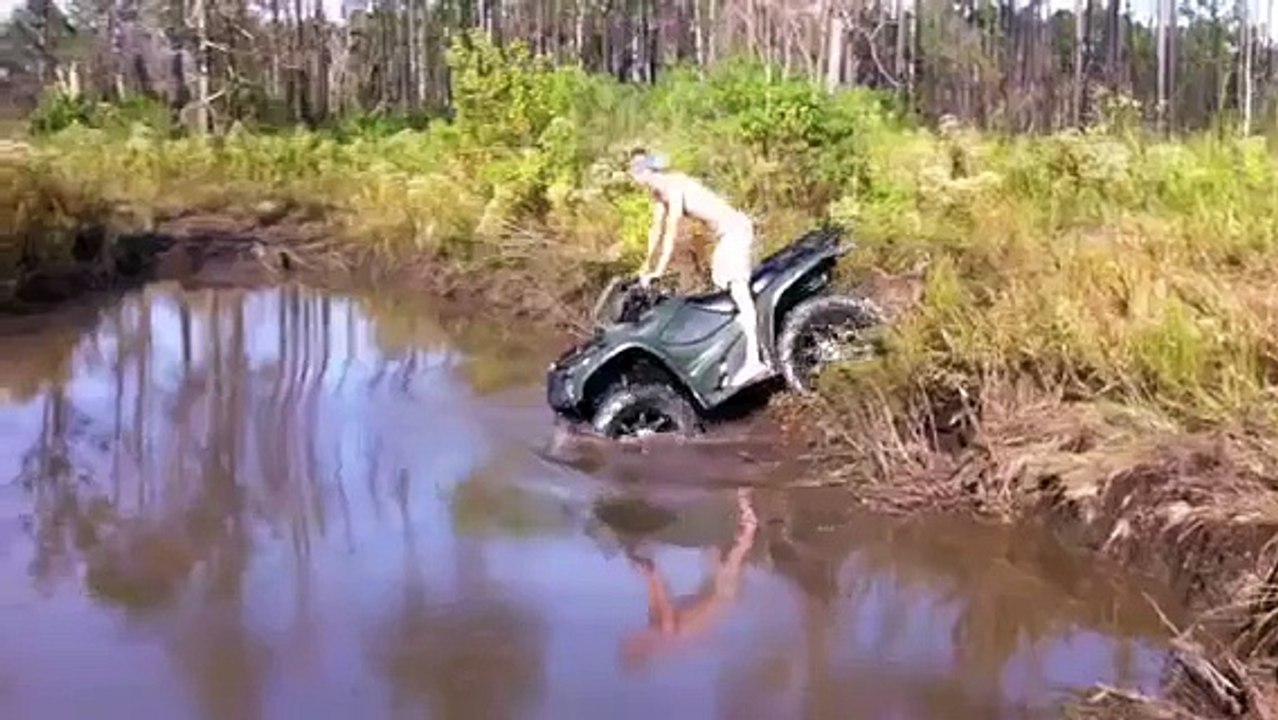 Four Wheeler in Deep Mud Hole