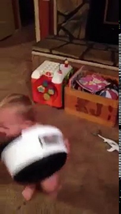 Little baby plays with a bucket so funny