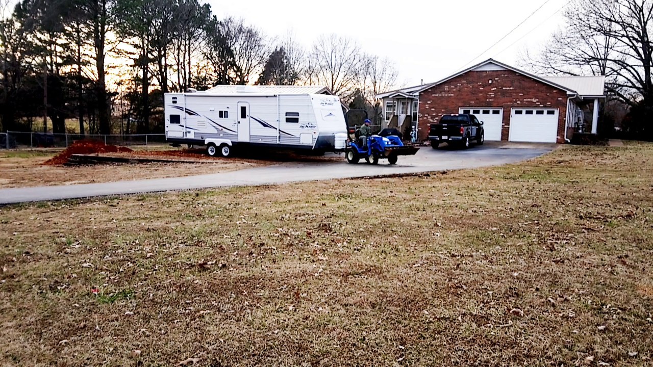 LS MT125 Tractor Moves Travel Trailer