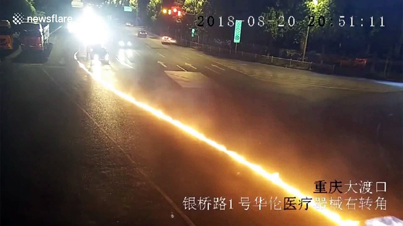 Hit-and-run car drags motorcycle along road in flames