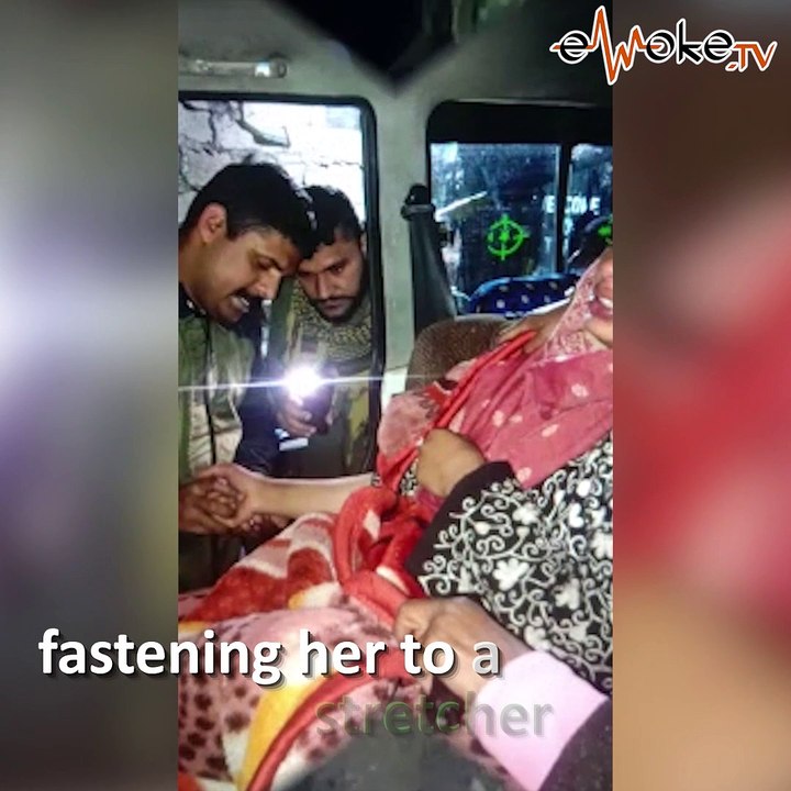 Army soldiers carry pregnant woman on shoulders