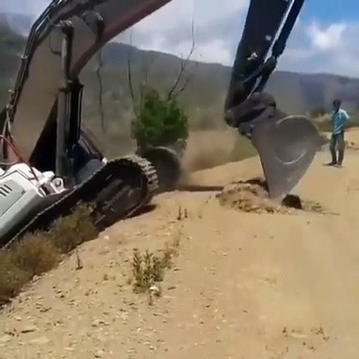 Powerful excavator climbing hill