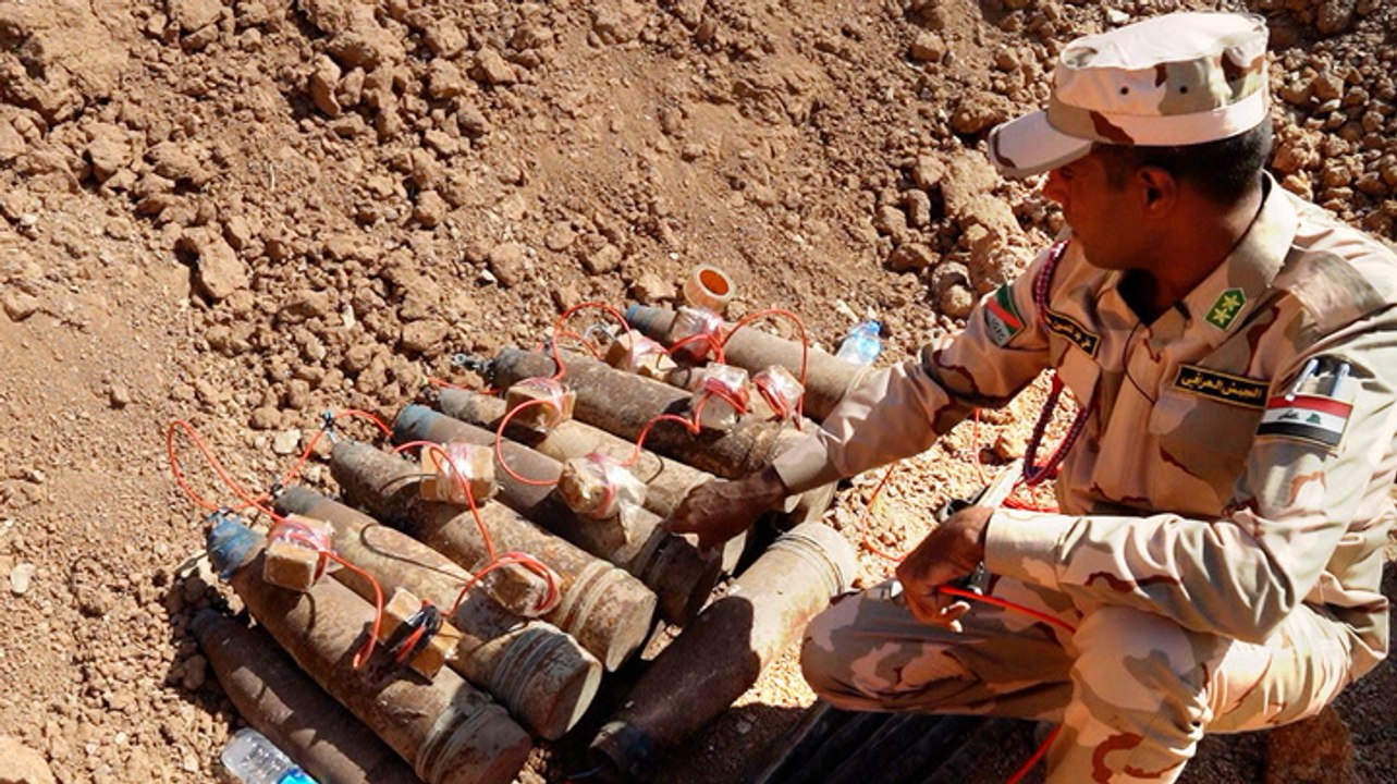 How people risk their lives digging up homemade bombs in Iraq