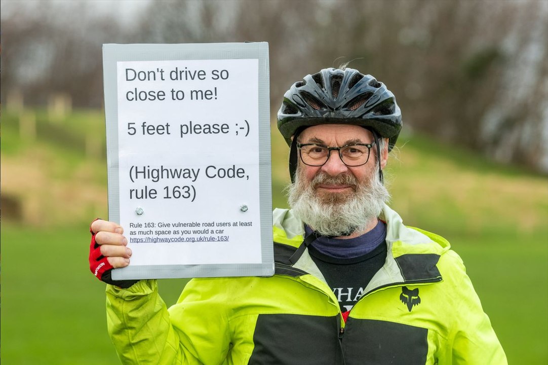 Pudsey cyclist attaches sign to bike asking drivers in Leeds to keep their distance