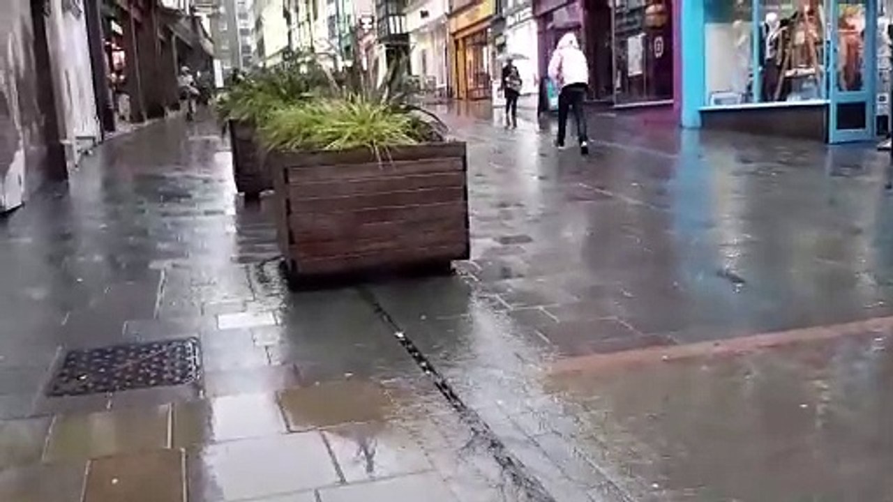 Water gushing down Pride Hill in Shrewsbury