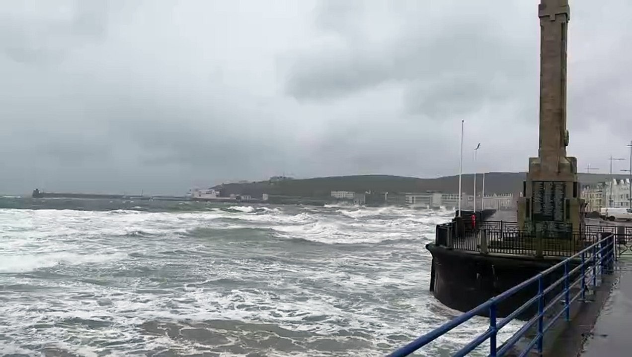 Waves crash over Douglas Promenade