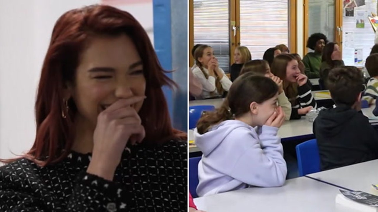 Dua Lipa surprises Year 6 class on return to old primary school
