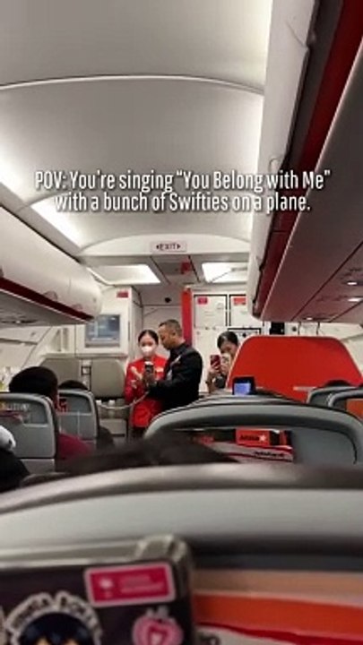 Singing "You Belong with Me" with fellow Swifties on a plane