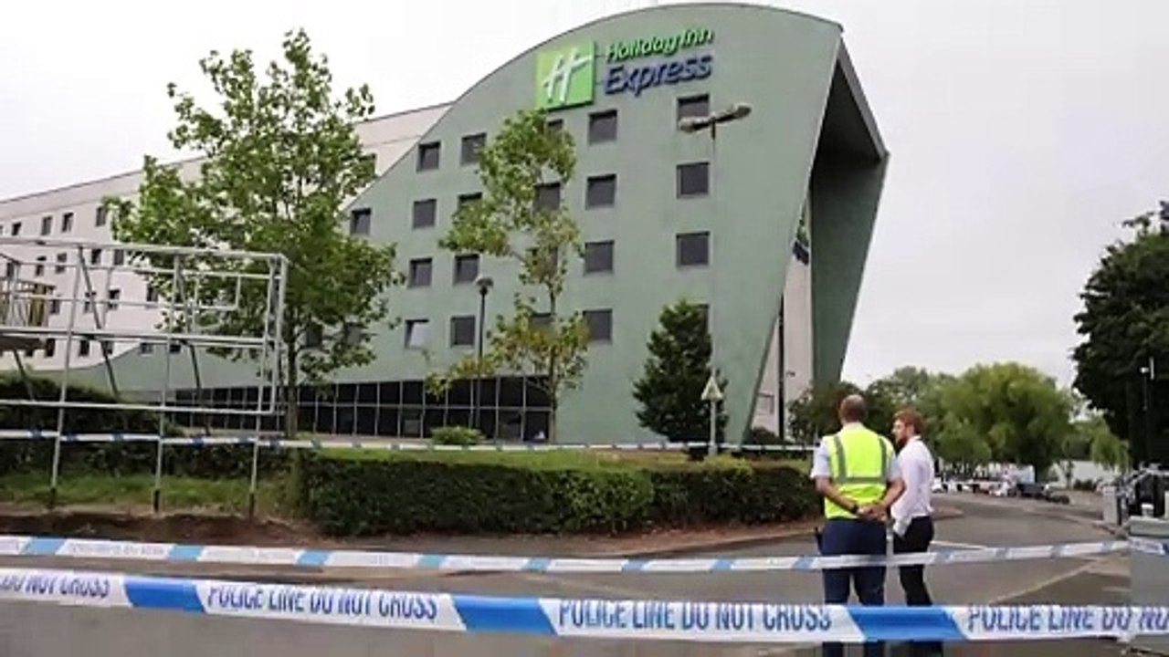 Police guard damaged Holiday Inn Express in Tamworth day after riots