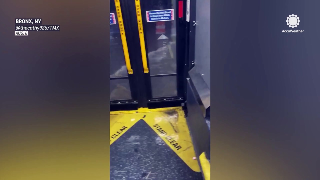 Floodwaters spill into bus in New York City