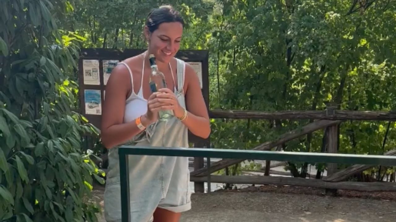 Girl's attempt to open a wine bottle in ends with breaking the bottle